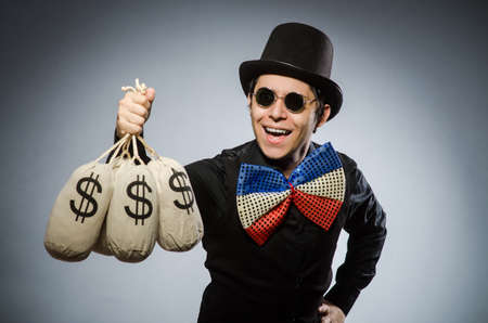 Funny man with money dollar sacksの写真素材