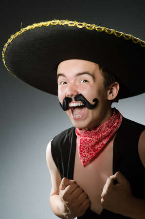 Person wearing sombrero hat in funny conceptの写真素材