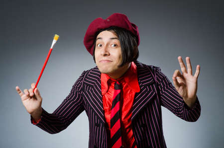 Funny artist with his artworkの写真素材