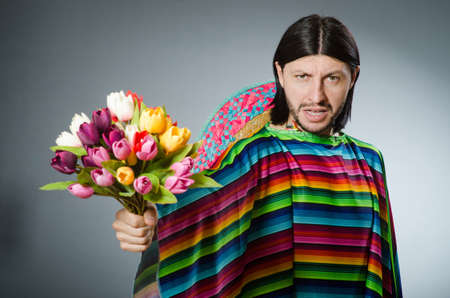 Mexican man with tulip flowersの写真素材