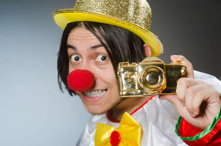 Funny clown against dark backgroundの写真素材
