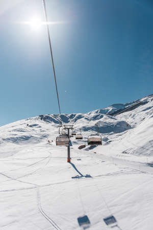Ski lifts durings bright winter dayの写真素材