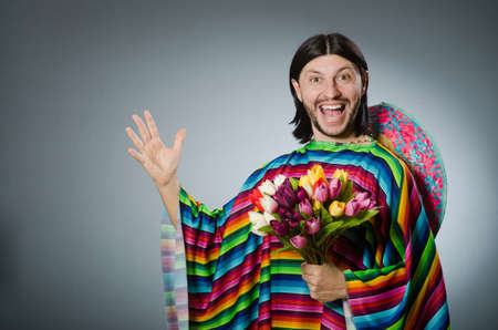 Mexican man with tulip flowersの写真素材