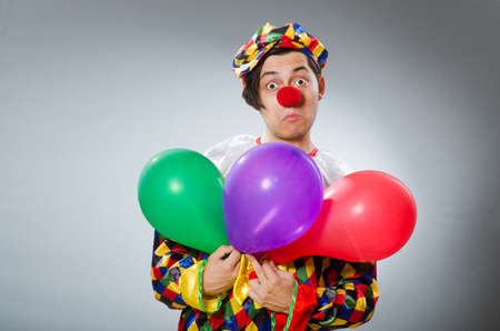 Clown with balloons in funny conceptの写真素材