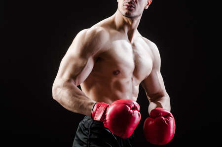 Muscular man in boxing concept