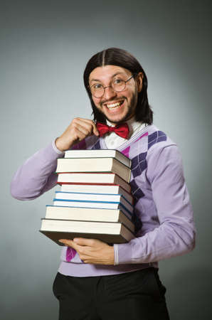 Young student with book in learning conceptの写真素材