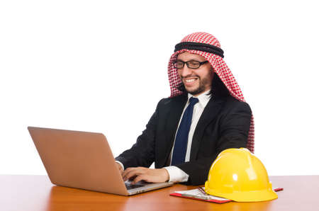 Arab man with computer and hardhatの写真素材