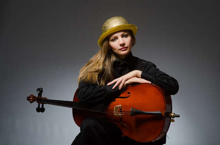 Woman playing classical cello in music concept