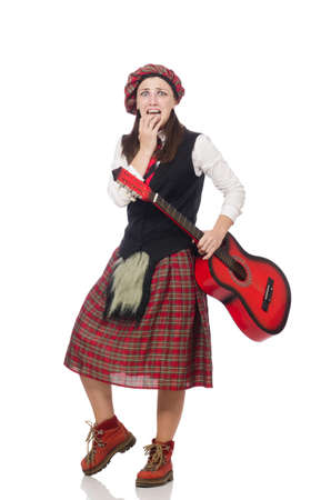 Woman in scottish clothing with guitarの写真素材