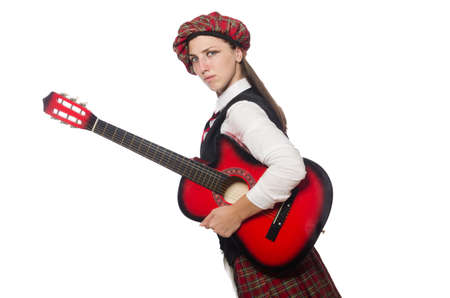 Woman in scottish clothing with guitar
