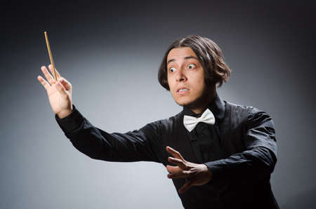 Funny conductor in musical conceptの写真素材