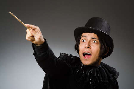 Funny magician wearing cylinder hatの写真素材