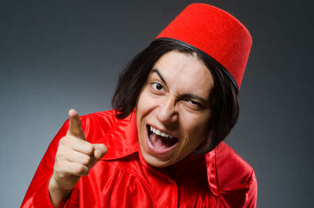 Man wearing red fez hatの写真素材