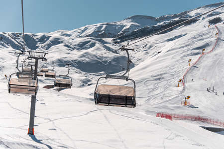 Ski lifts durings bright winter day