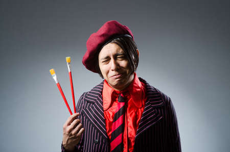 Funny artist with his artworkの写真素材