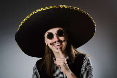 Person wearing sombrero hat in funny conceptの写真素材