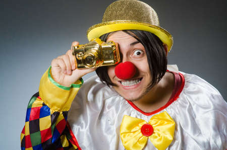 Funny clown against dark backgroundの写真素材