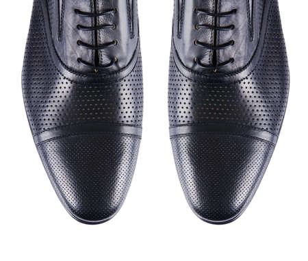 Tip of male shoes isolated on whiteの写真素材