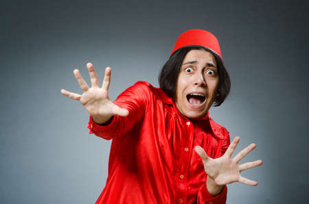 Man wearing red fez hatの写真素材