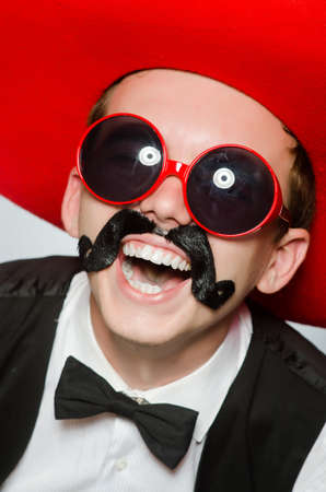 Person wearing sombrero hat in funny conceptの写真素材