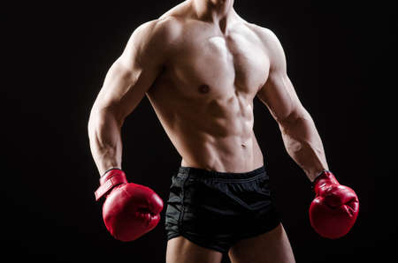 Muscular man in boxing concept