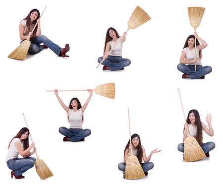 Woman with broom isolated on whiteの写真素材