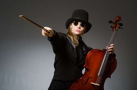 Woman playing classical cello in music conceptの写真素材