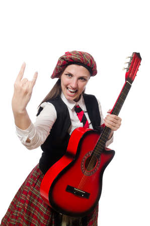 Woman in scottish clothing with guitarの写真素材
