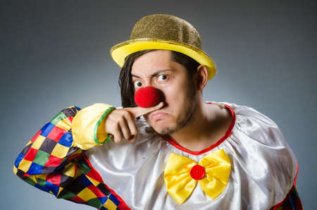 Funny clown against dark backgroundの写真素材