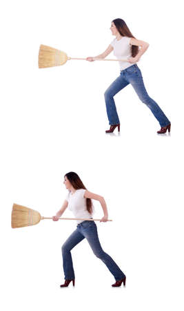 Woman with broom isolated on whiteの写真素材