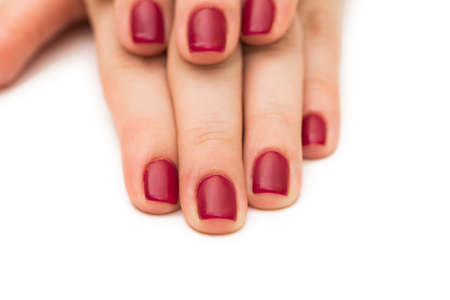 Woman hands with red nail isolated on white