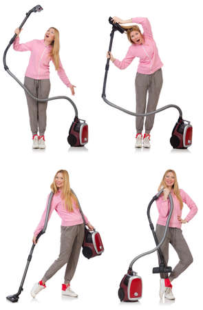 Young woman with vacuum cleaner on whiteの写真素材