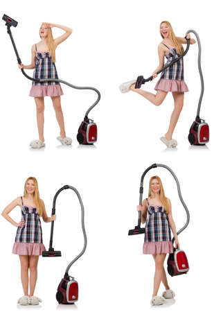 Young woman with vacuum cleaner on whiteの写真素材