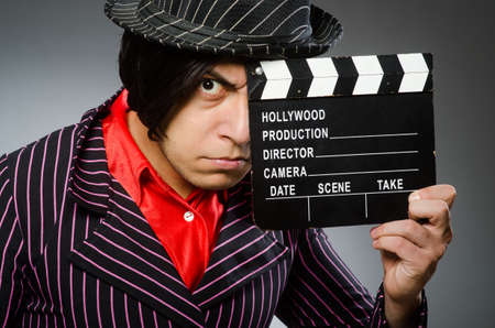 Funny man with movie board