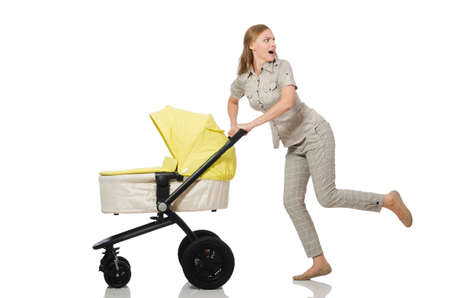 Woman with baby and pram isolated on whiteの写真素材