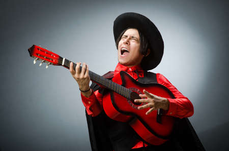 Man playing guitar in romantic conceptの写真素材