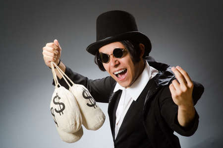 Funny man with dollar sacksの写真素材