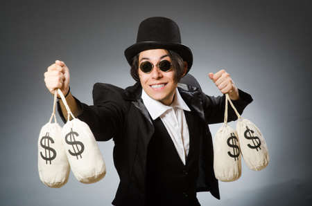 Funny man with dollar sacksの写真素材