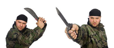 Young man in soldier uniform holding knife isolated on whiteの写真素材