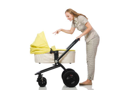 Woman with baby and pram isolated on whiteの写真素材