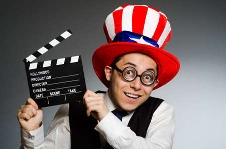 Man with american hat and movie board