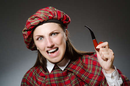 Woman wearing traditional scottish clothingの写真素材