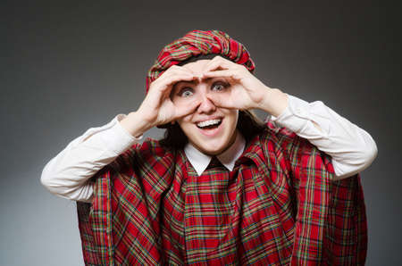 Woman wearing traditional scottish clothingの写真素材