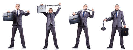 Businessman with shackles on whiteの写真素材