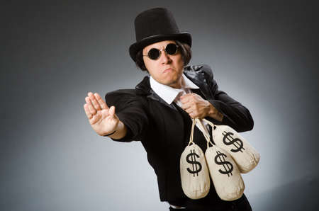 Funny man with dollar sacksの写真素材