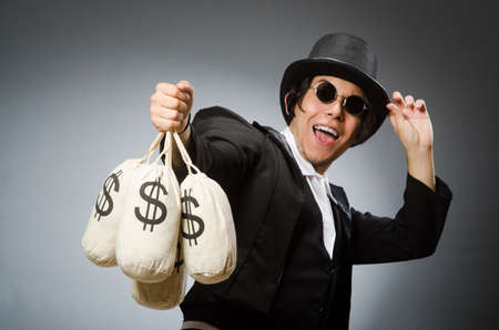 Funny man with dollar sacksの写真素材