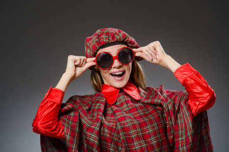 Woman wearing traditional scottish clothingの写真素材