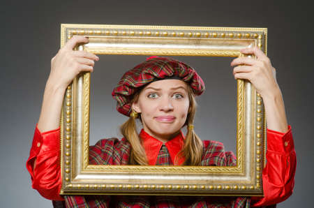 Woman in scottish clothing in art conceptの写真素材