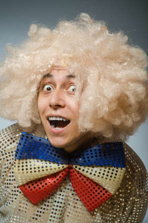 Funny man with afro wigの写真素材