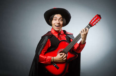 Man playing guitar in romantic conceptの写真素材